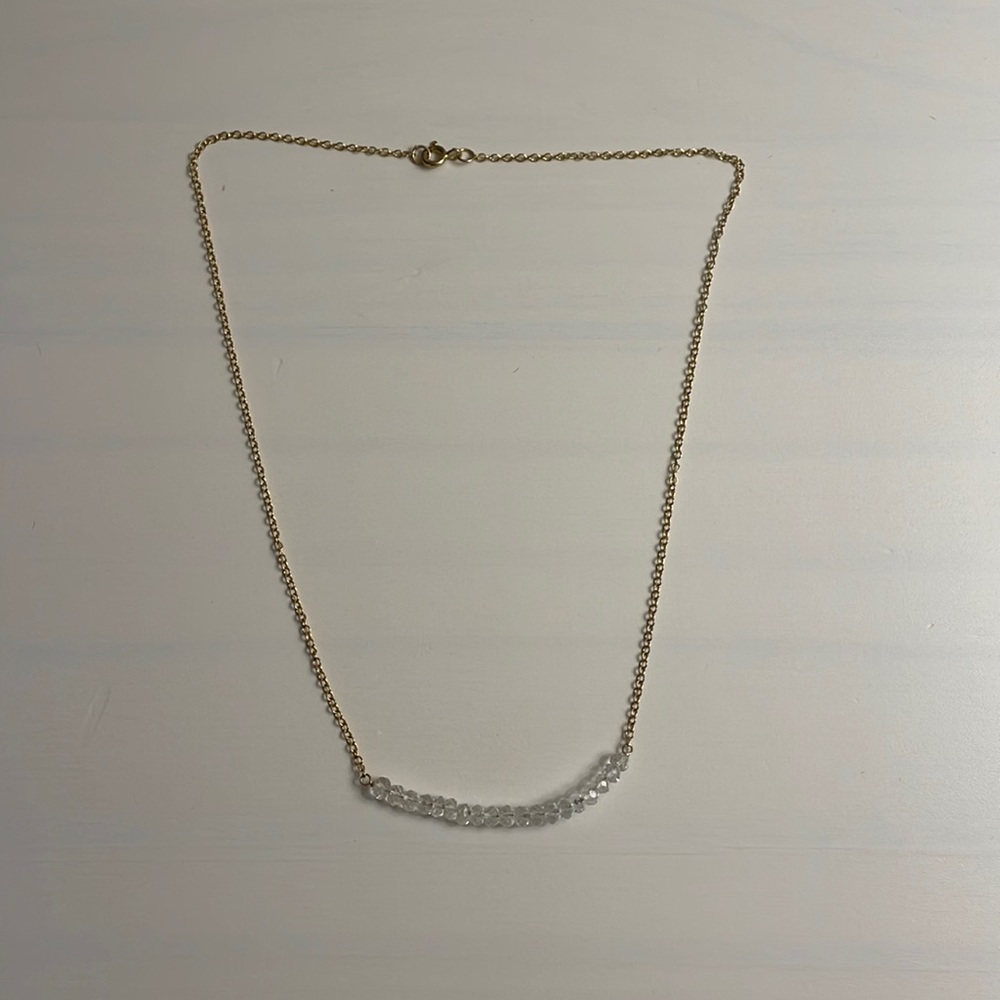 Gold necklace with clear diamond-like beads